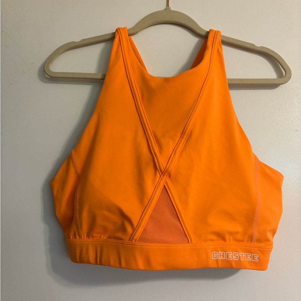 The Chestee Orange Racerback Sports Bra with Medium Support